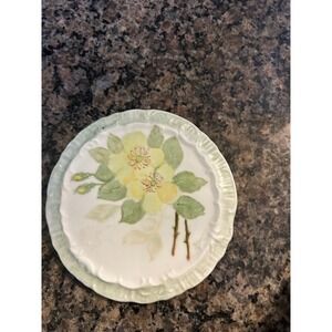antique hand-painted trivet plate featuring a yellow buttercup flower
